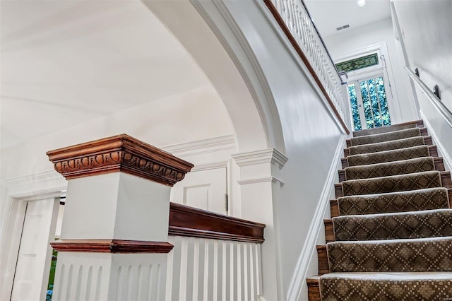 stairs featuring ornamental molding