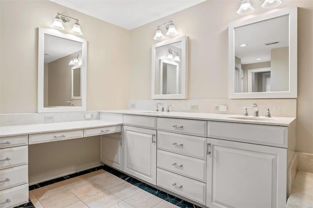 bathroom with tile patterned flooring and vanity