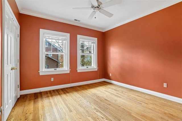 unfurnished room featuring light hardwood / wood-style floors, ceiling fan, and ornamental molding