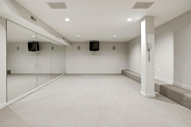 basement with light colored carpet