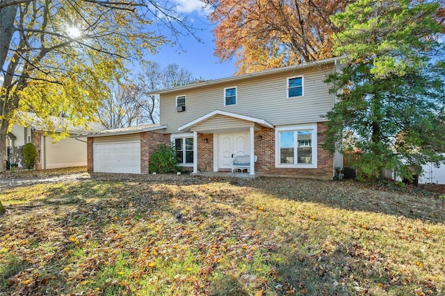 view of front facade featuring a front yard and a garage