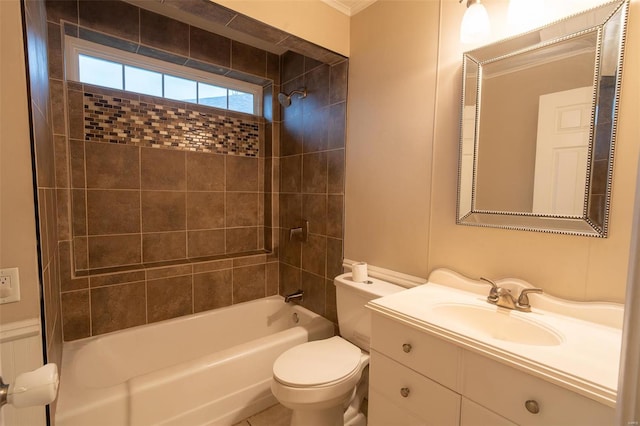 full bathroom with vanity, toilet, tiled shower / bath, and crown molding