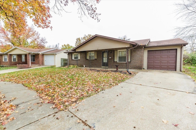 single story home with a garage and a front lawn