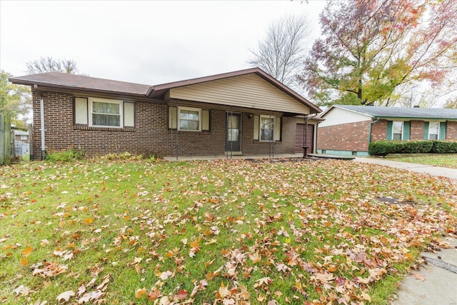 single story home featuring a front yard