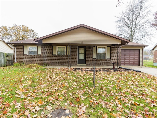 single story home featuring a front yard and a garage