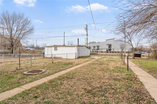 view of yard with a fire pit