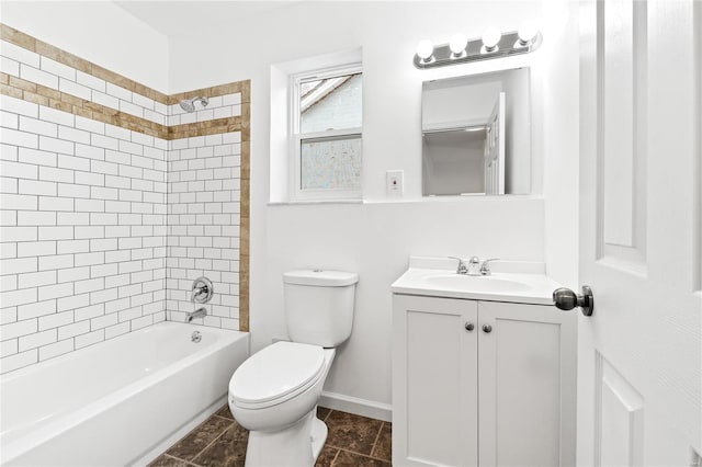 full bathroom with tiled shower / bath combo, toilet, and vanity