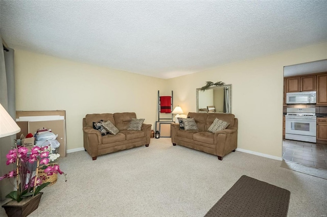 carpeted living room featuring a textured ceiling