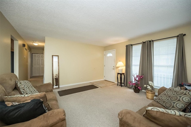 living room with light carpet and a textured ceiling