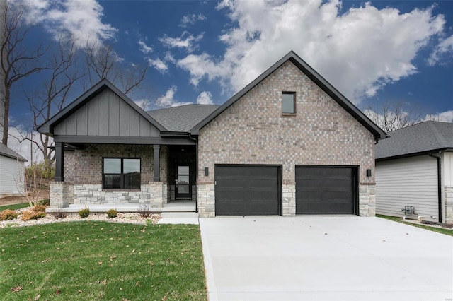 view of front of house featuring a porch, a garage, and a front lawn