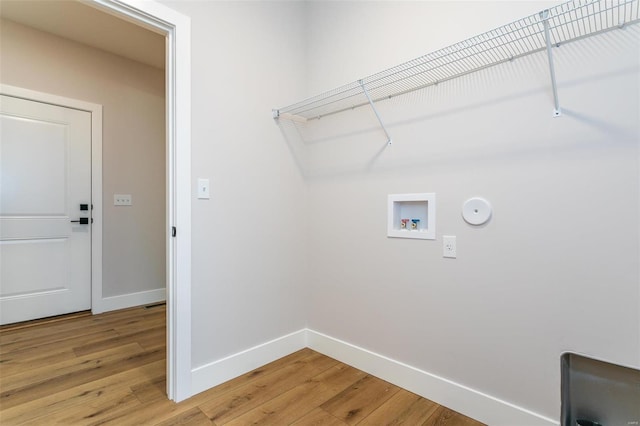 laundry area with hardwood / wood-style flooring, gas dryer hookup, and washer hookup