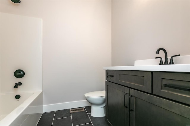 full bathroom with tile patterned flooring, vanity, tub / shower combination, and toilet