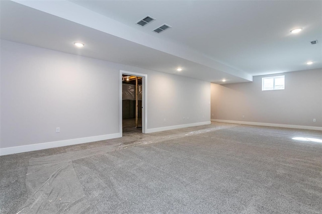 basement featuring light colored carpet