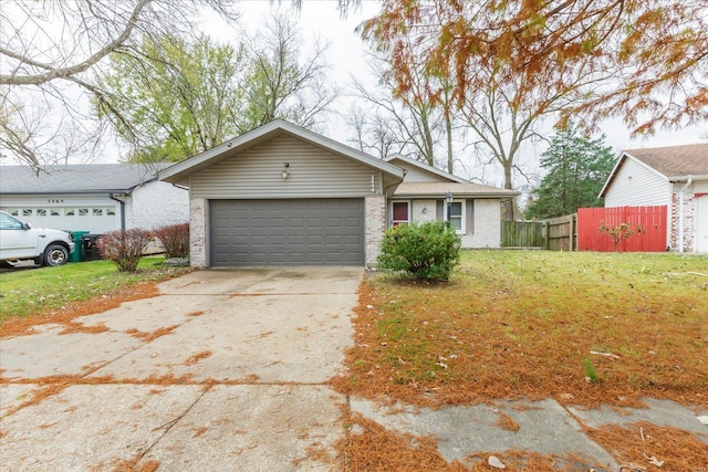 ranch-style home featuring a garage and a front lawn