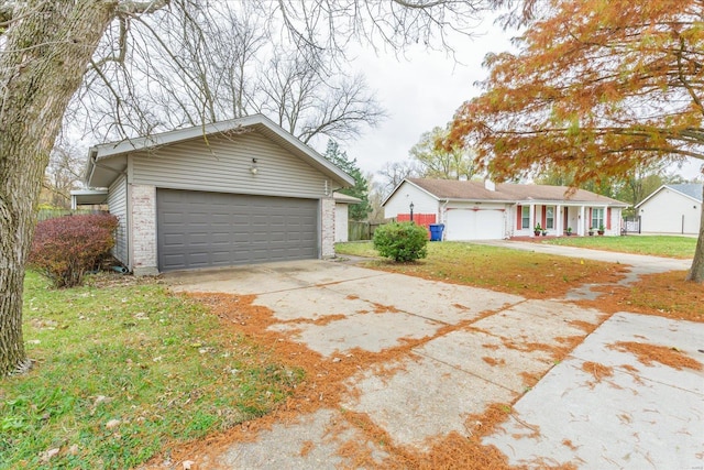 exterior space featuring a garage and a front yard