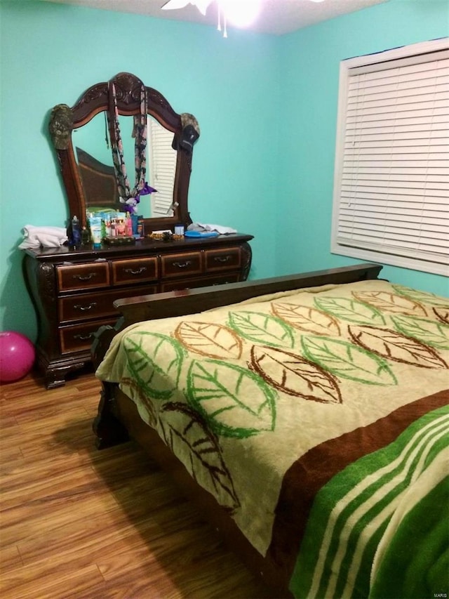 bedroom featuring ceiling fan and light wood-type flooring