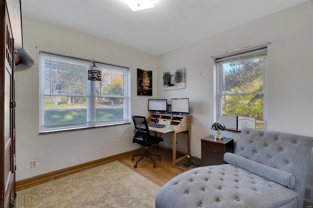 office area with light hardwood / wood-style flooring