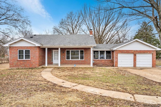 ranch-style home with a garage, covered porch, and a front yard