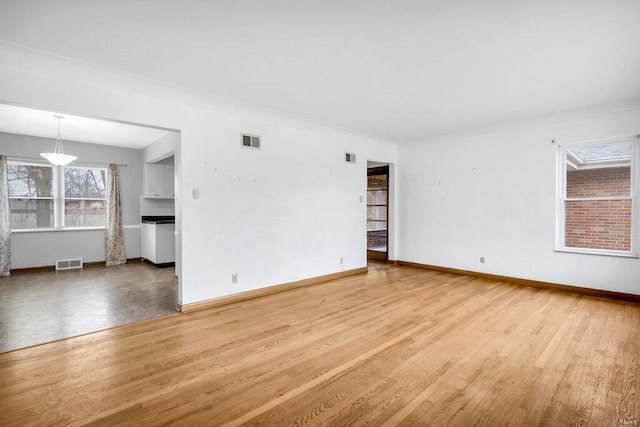 unfurnished room featuring light wood-type flooring