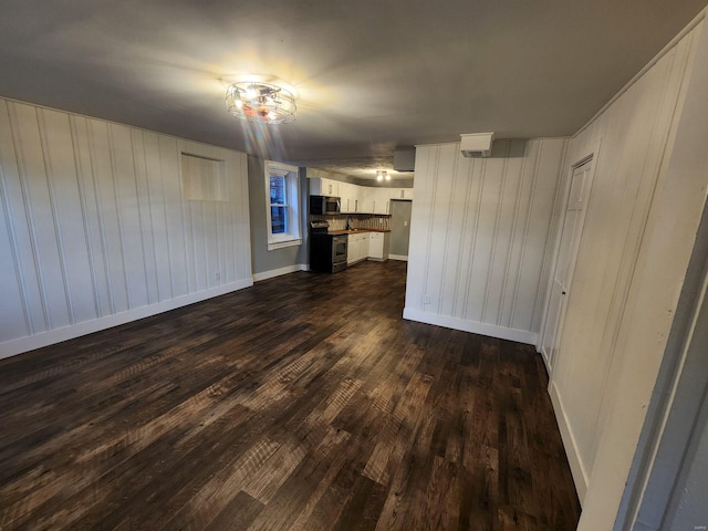 unfurnished living room featuring dark wood-type flooring