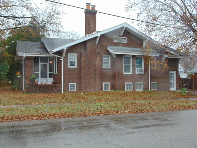 view of side of property with a sunroom