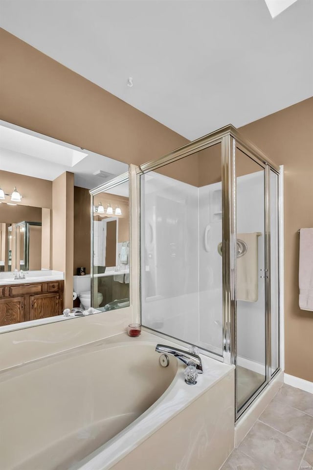 full bathroom with tile patterned flooring, vanity, toilet, and independent shower and bath