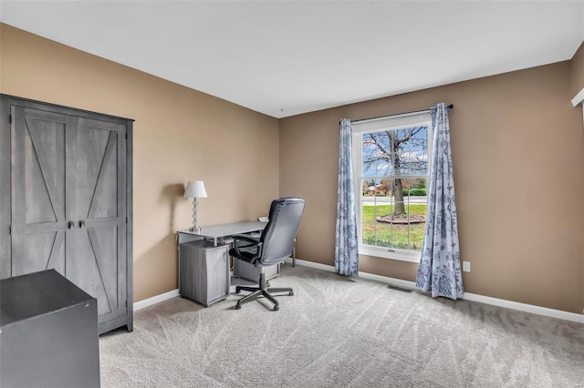 office area featuring light colored carpet