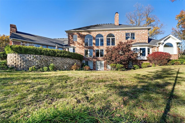 back of house featuring a yard