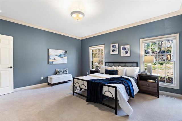 carpeted bedroom featuring crown molding