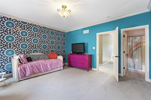 bedroom with connected bathroom, light carpet, and ornamental molding