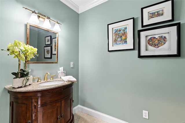 bathroom featuring crown molding and vanity