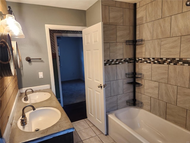 bathroom featuring tile patterned floors, vanity, and tiled shower / bath combo