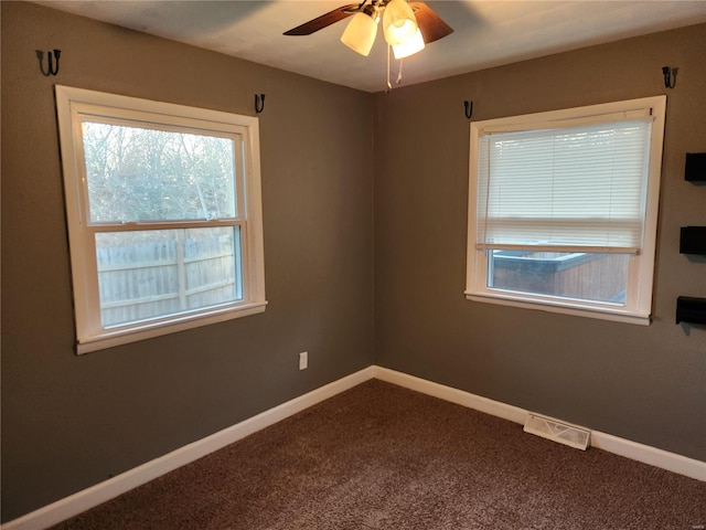 unfurnished room with ceiling fan and carpet floors