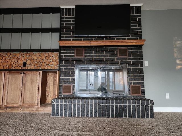 interior details with carpet and a fireplace