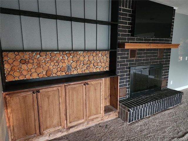 interior space with a fireplace and carpet floors