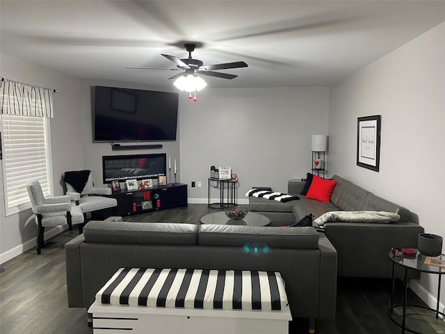 living room with dark hardwood / wood-style flooring and ceiling fan