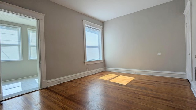 spare room with hardwood / wood-style flooring