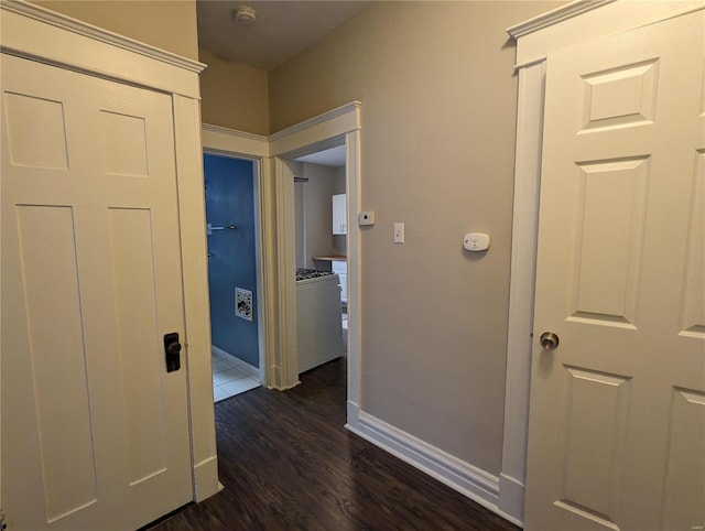 hallway with dark wood-type flooring