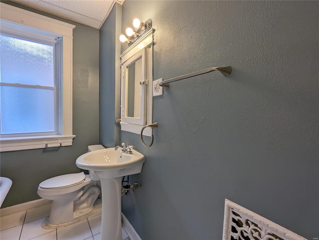 bathroom with tile patterned floors and toilet