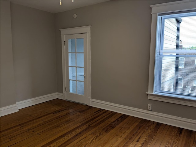 empty room featuring dark wood-type flooring