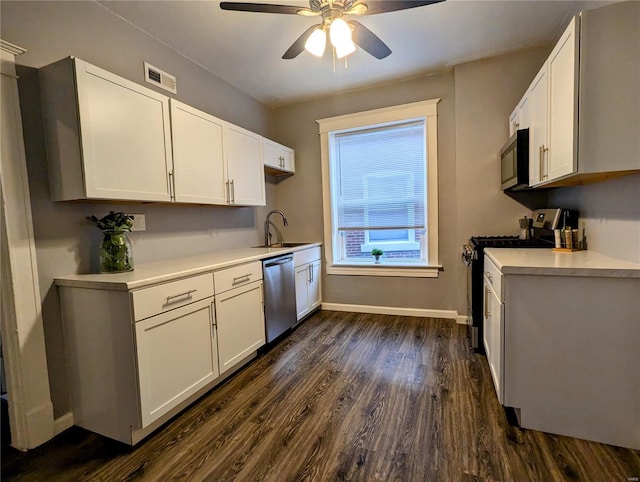 kitchen featuring dark hardwood / wood-style floors, white cabinetry, and stainless steel appliances