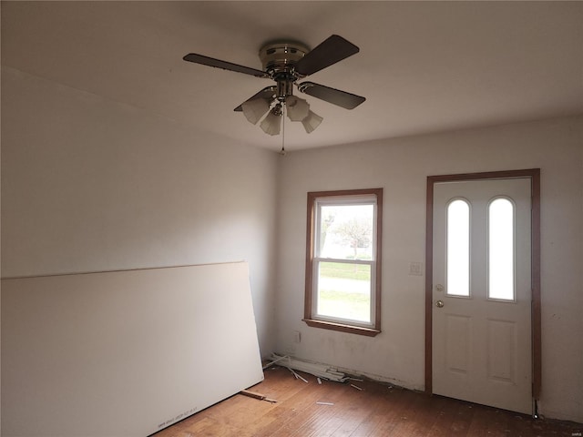 foyer entrance with hardwood / wood-style floors and ceiling fan