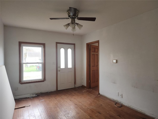 foyer entrance with ceiling fan and hardwood / wood-style floors