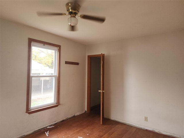 unfurnished room featuring ceiling fan and hardwood / wood-style flooring