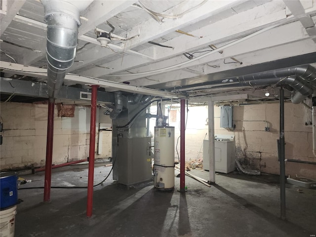 basement with heating unit, electric panel, washer / clothes dryer, and water heater