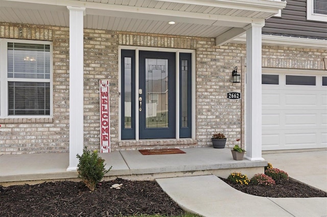 view of exterior entry featuring a porch