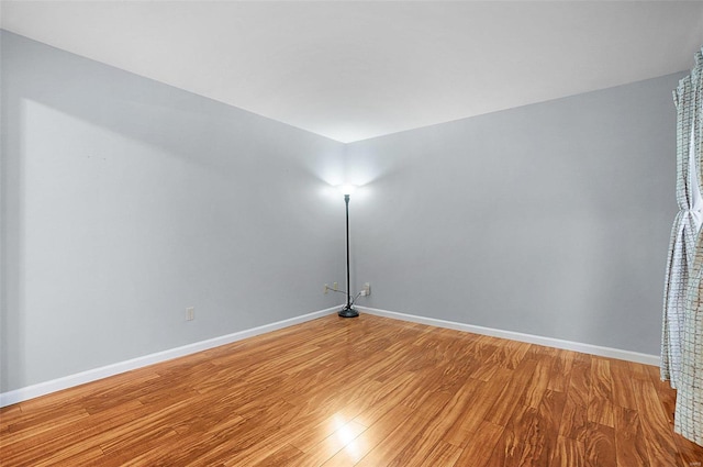 unfurnished room with light hardwood / wood-style flooring