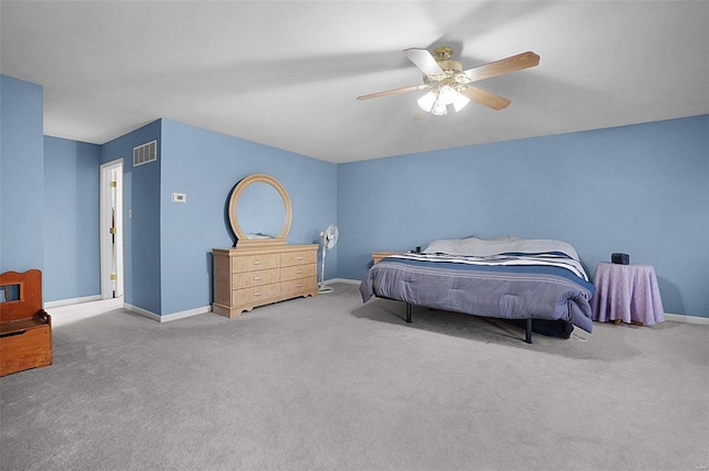 bedroom featuring ceiling fan and carpet