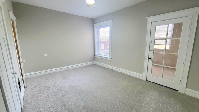 unfurnished bedroom with light carpet and ceiling fan