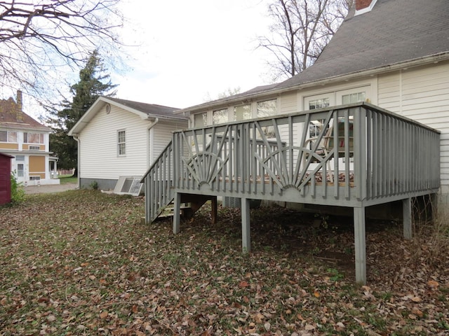 rear view of house featuring a deck